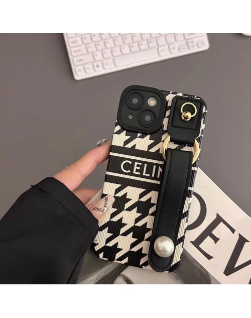 Celine/セリーヌ ブランド iphone14/14 pro/14 pro maxケース 個性 ハンドバンド付 モノグラム レザー製 ジャケット型 黒白色 リング付 アイフォン14プロ マックス/14プロ/14/13/12/11/x/xs/xrカバー ペアお揃い ファッション 高級 人気 メンズ レディース