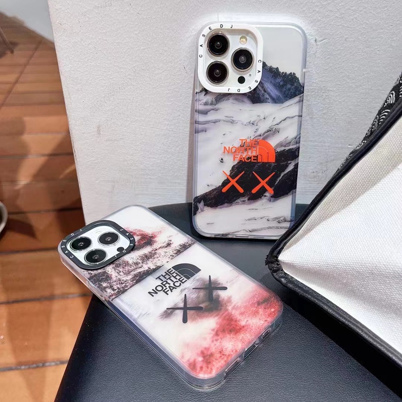 Kaws/カウズ The North Face ザ.ノース.フェイス コラボ iphone14Pro max 14Plusスマホケース かわいい クリア 雪山 XX柄 ジャケット型